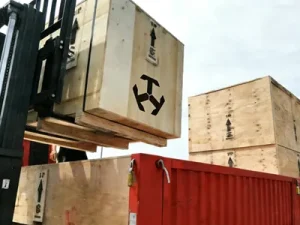Specialized wooden crate packaging for crane parts and accessories.