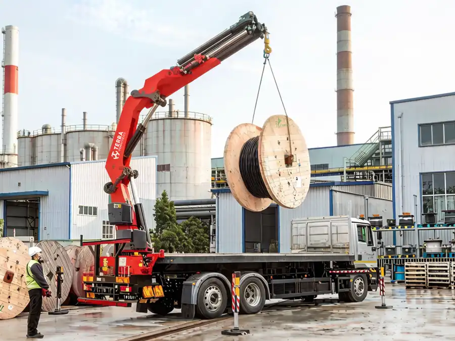 TERRA crane performing utility pole installation for a municipal infrastructure project.